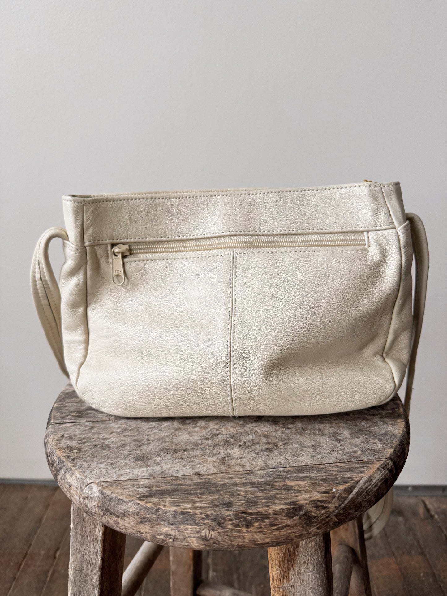 White Leather Shoulder Bag with Tassel Zipper Pull