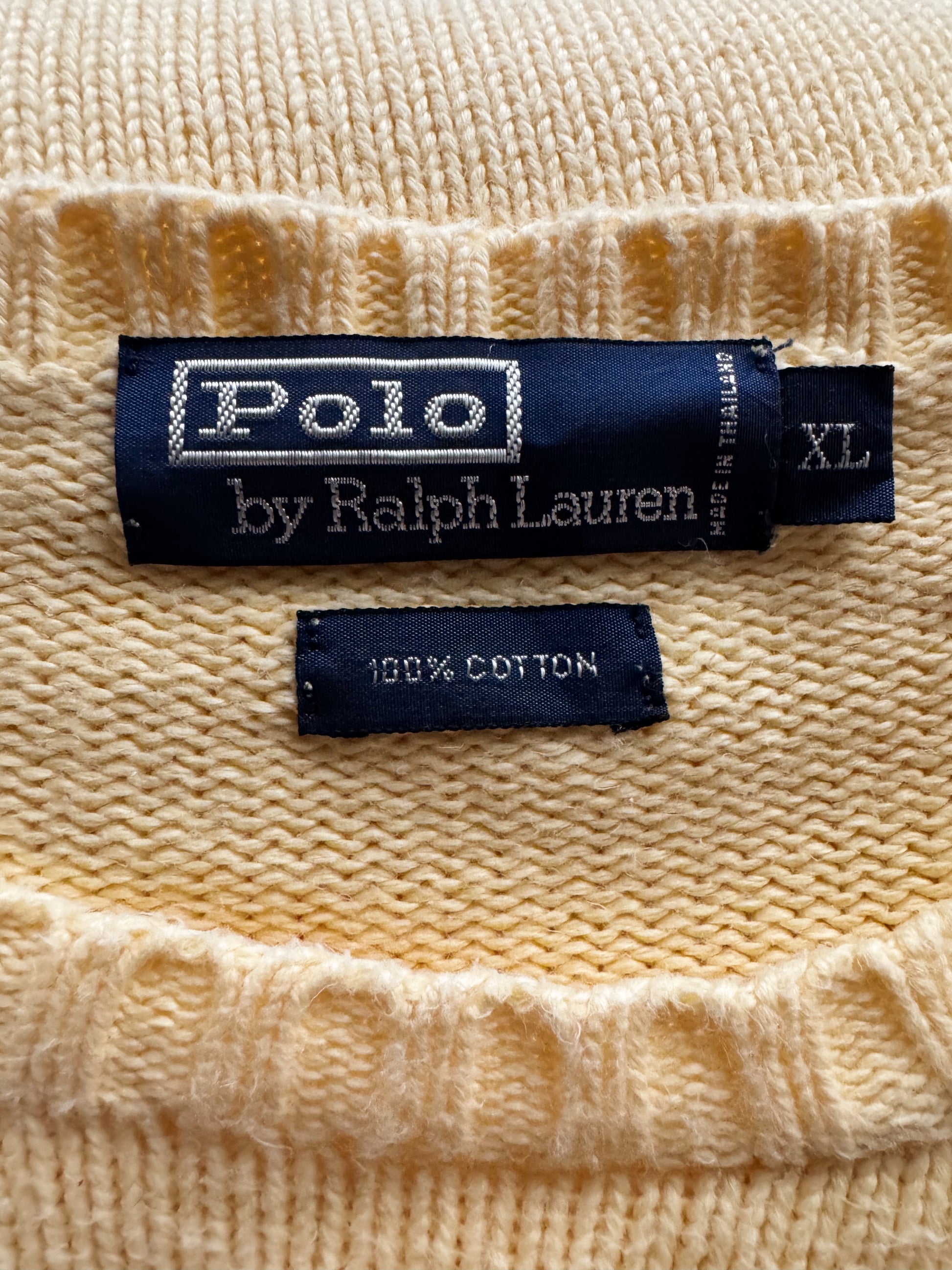 Polo by Ralph Lauren label on a beige fabric background
