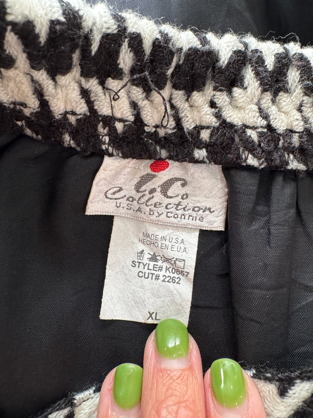 Close-up of a garment's interior neck label reading 'i.c.